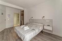 Postel nebo postele na pokoji v ubytování Hostal Lar