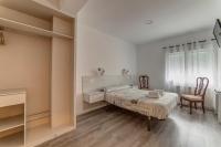 Postel nebo postele na pokoji v ubytování Hostal Lar