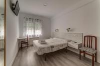 Postel nebo postele na pokoji v ubytování Hostal Lar