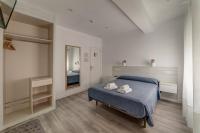 Postel nebo postele na pokoji v ubytování Hostal Lar