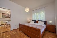 Posteľ alebo postele v izbe v ubytovaní Apartmani Sara i Klara