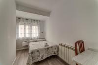 Postel nebo postele na pokoji v ubytování Hostal Lar