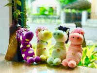 four stuffed teddy bears sitting on a table at Great Nature Villa in Jiji