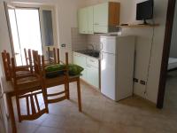 A kitchen or kitchenette at Residence e B&B La Cappella Del Convento