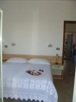 A bed or beds in a room at Residence e B&B La Cappella Del Convento
