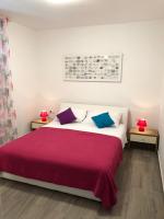 Postel nebo postele na pokoji v ubytování Apartments J&K