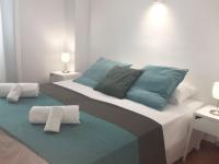 A bed or beds in a room at Apartamentos Albertos
