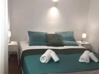 A bed or beds in a room at Apartamentos Albertos