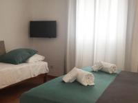 A bed or beds in a room at Apartamentos Albertos