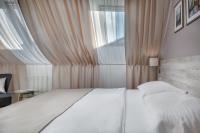 a bedroom with a white bed and a window at Hotel Florenc in Prague