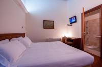 Posteľ alebo postele v izbe v ubytovaní Hotel Flora