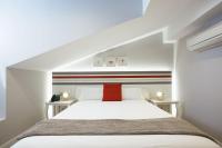 Posteľ alebo postele v izbe v ubytovaní Legazpi Doce Rooms & Suites