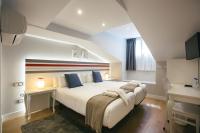Posteľ alebo postele v izbe v ubytovaní Legazpi Doce Rooms & Suites