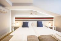 Posteľ alebo postele v izbe v ubytovaní Legazpi Doce Rooms & Suites
