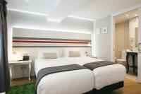 Posteľ alebo postele v izbe v ubytovaní Legazpi Doce Rooms & Suites