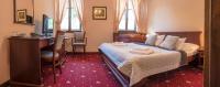 Postel nebo postele na pokoji v ubytování Hotel Buchlovice