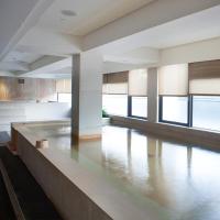 a large room with a pool in the middle at Beitou Sweet Me Hot Spring Resort in Taipei
