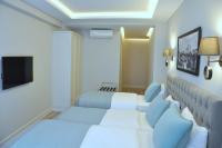 TV a/nebo společenská místnost v ubytování Centrum Suites İstanbul