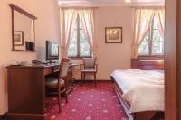 Postel nebo postele na pokoji v ubytování Hotel Buchlovice