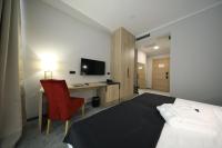 Televízia a/alebo spoločenská miestnosť v ubytovaní Teatro Verdi Boutique Hotel
