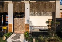 a building with a courtyard with a fountain at Eastin Ashta Resort Canggu in Canggu