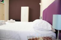 A bed or beds in a room at Urban Pop 2 BnB