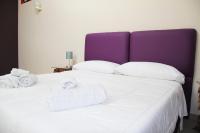 A bed or beds in a room at Urban Pop 2 BnB
