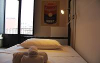 A bed or beds in a room at Urban Pop 2 BnB