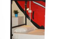 A bed or beds in a room at Urban Pop 2 BnB
