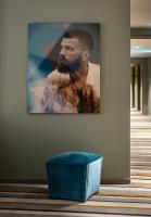 a picture of a man hanging on a wall at AMERON Hamburg Hotel Speicherstadt in Hamburg