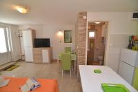 Televízia a/alebo spoločenská miestnosť v ubytovaní Apartments Zia