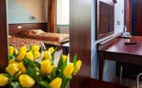 Łóżko lub łóżka w pokoju w obiekcie Hotel Irys