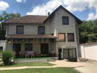 a brick house with a patio in the yard at LM 19 in Novi Sad