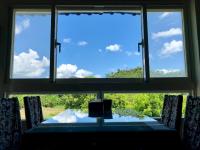 a view from a window of a table and chairs at Liang Chen Mei Jin B&amp;B in Shuangxi