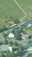 an aerial view of a town with houses and a road at Villa Jani b&amp;b in Breitscheid