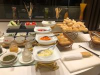 a table topped with bowls and plates of food at Fortune Park, Vellore - Member ITC Hotels' Group in Vellore