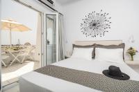 Postel nebo postele na pokoji v ubytování Naxos Dream Oniro Studios - Adults Only