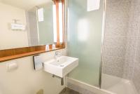 a bathroom with a sink and a shower at Campanile Toulouse Sesquieres in Toulouse
