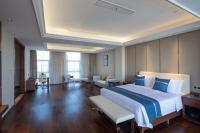 Postel nebo postele na pokoji v ubytování Yushan Town Tianji Cloud Business Hotel