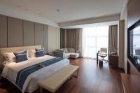 Postel nebo postele na pokoji v ubytování Yushan Town Tianji Cloud Business Hotel