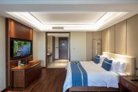 Postel nebo postele na pokoji v ubytování Yushan Town Tianji Cloud Business Hotel