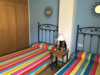 Postel nebo postele na pokoji v ubytování Casa Vistas Conil - FAMILIAS Y PAREJAS