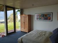 Łóżko lub łóżka w pokoju w obiekcie Glas House - Design Holiday Home