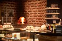 um balcão com alguns doces e um forno de tijolos em First Group Breakers Resort - Official em Durban