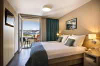 Postel nebo postele na pokoji v ubytování San Marino Resort