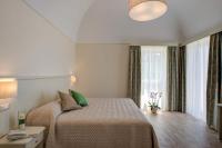 A bed or beds in a room at Agriturismo La Peppina