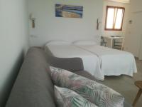 Łóżko lub łóżka w pokoju w obiekcie Apartamentos Villa Primera