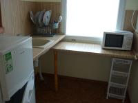 Kuchyň nebo kuchyňský kout v ubytování Nimpha Bungalows
