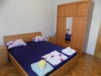 Posteľ alebo postele v izbe v ubytovaní Apartment Leporiz