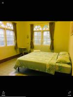 Postel nebo postele na pokoji v ubytování Roo Poo Guest House